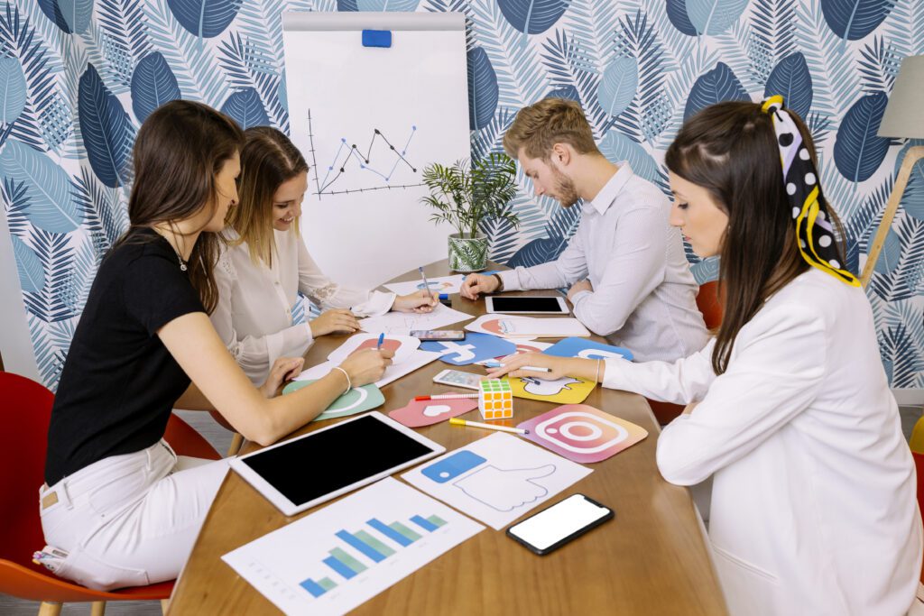group of employees discussing strategies around a table