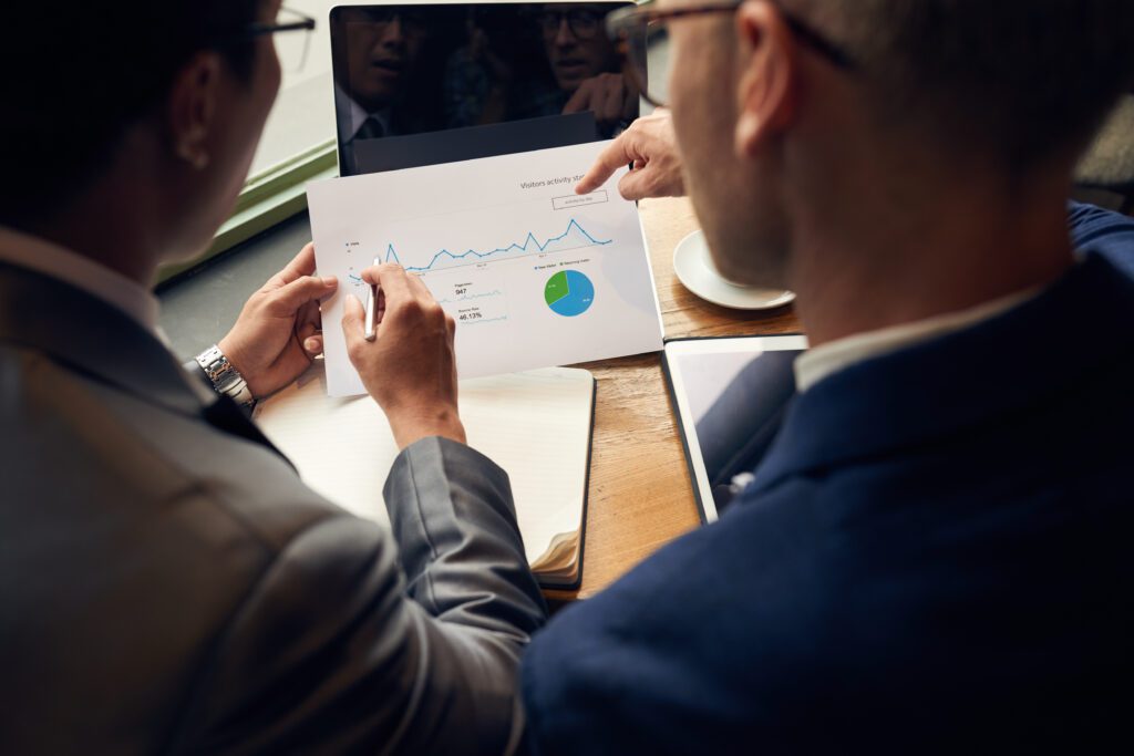 Businessmen analyzing CX Survey Response Rate Report