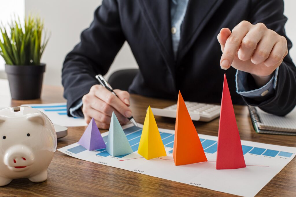 A man mapping the growth rate on a table