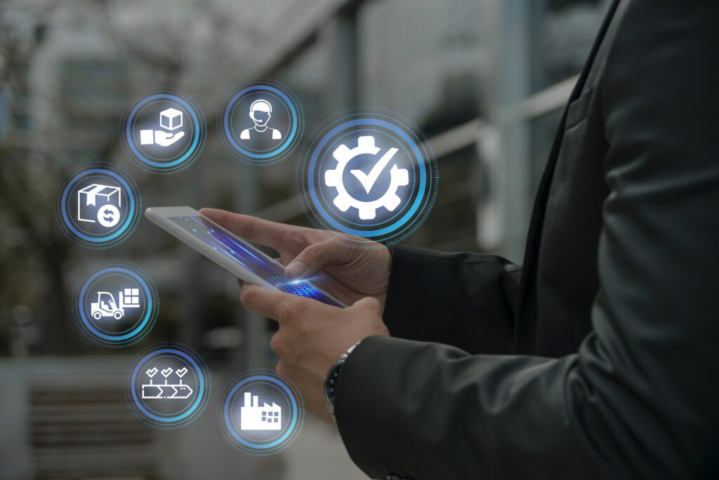 A man wearing a black coat holding tablet and managing automotive service in reputation management software